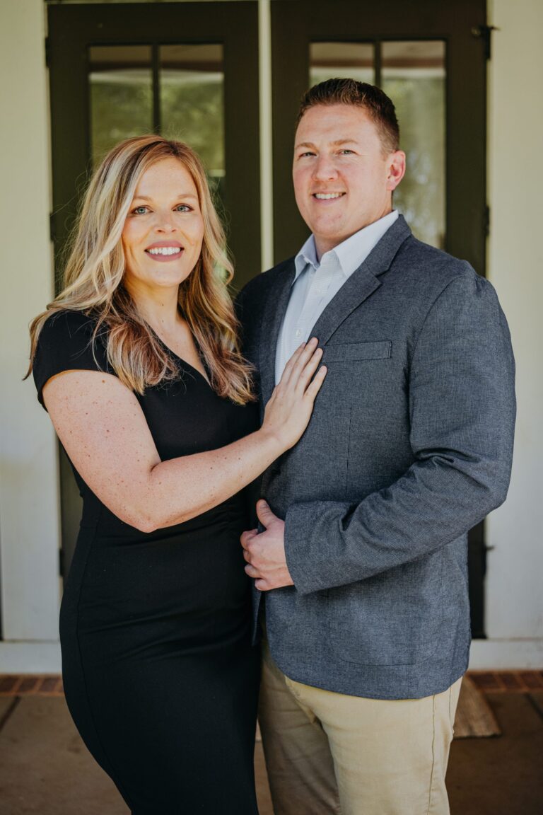 Arrio and Kelsey Granum on a front porch in Columbus, GA
