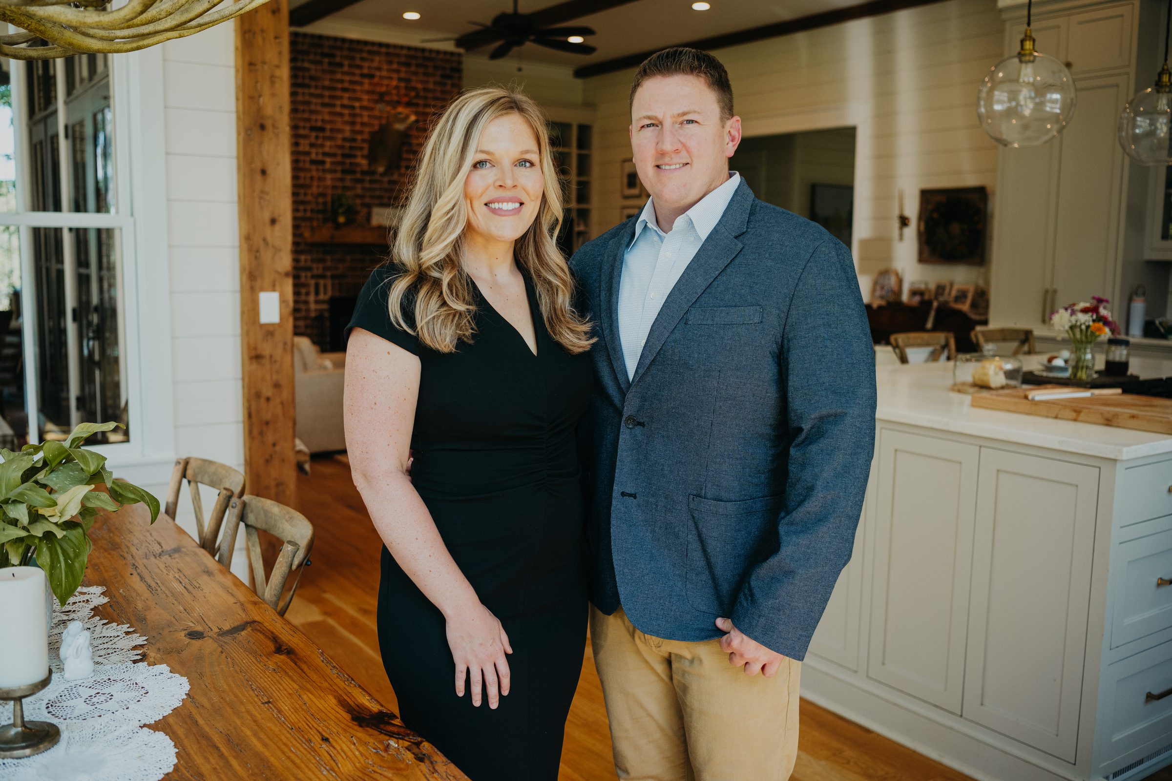 Arrio and Kelsey Granum planning a PCS home search at their kitchen table near Columbus, GA