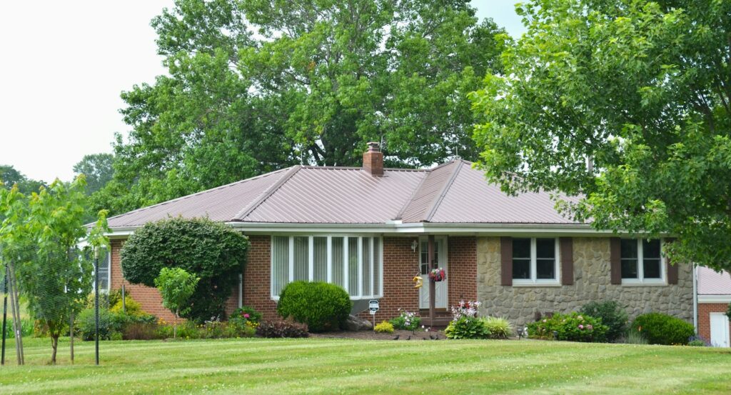 Brick ranch home with a landscaped front yard: the curb appeal buyers notice first when you sell a house in Columbus, GA